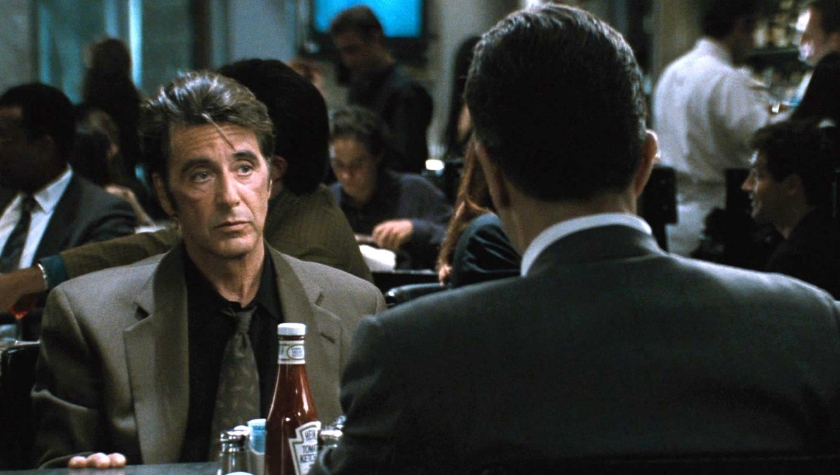 Vincent Hanna (Al Pacino) sitting across from Neil McCauley in the diner scene from Heat