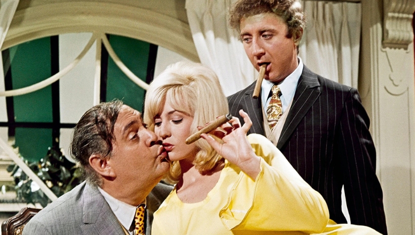 Scene from the 1967 film The Producers, with Zero Mostel, Gene Wilder, and a blonde woman with cigars